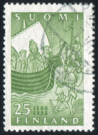 FINLAND - CIRCA 1955: stamp printed by Finland, shows Bishop Henrik and Clergy on the Ship, circa 1955の写真素材