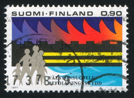 FINLAND - CIRCA 1977: stamp printed by Finland, shows Civil defense for security, circa 1977の写真素材