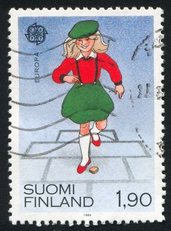 FINLAND - CIRCA 1989: stamp printed by Finland, shows Hopscotch, circa 1989の写真素材
