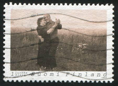 FINLAND - CIRCA 1997: stamp printed by Finland, shows Couple Dancing Tango, circa 1997のeditorial素材