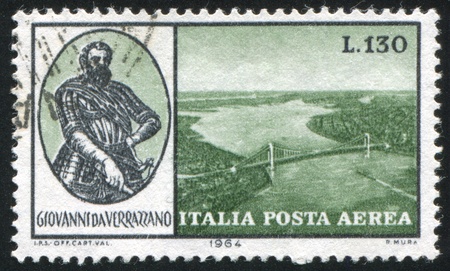 ITALY - CIRCA 1964: stamp printed by Italy, shows Giovanni da Verrazano and Verrazano-Narrows Bridge, New York Bay, circa 1964のeditorial素材