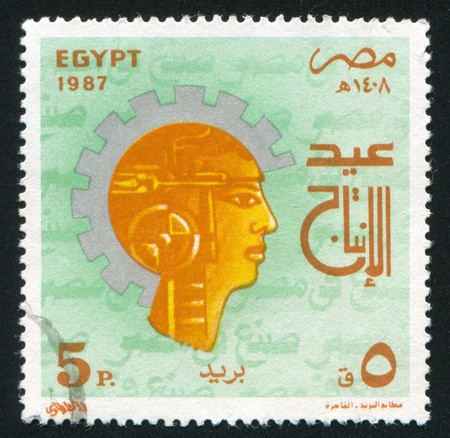 EGYPT - CIRCA 1987: stamp printed by Egypt, shows Industry Day Emblem, portrait, circa 1987のeditorial素材