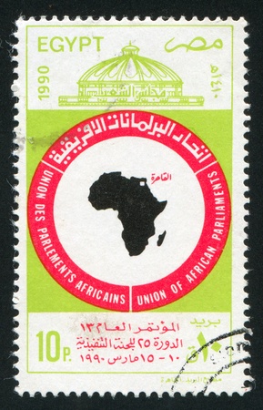 EGYPT - CIRCA 1990: stamp printed by Egypt, shows Emblem, Conference Center, circa 1990のeditorial素材