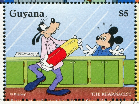 GUYANA - CIRCA 1995: stamp printed by Guyana, shows Walt Disney characters, Mickey Mouse and Goofy, circa 1995のeditorial素材