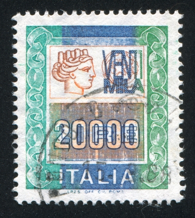 ITALY - CIRCA 1977: stamp printed by Italy, shows head of a woman, who symbolize âItaliaâ, circa 1977のeditorial素材