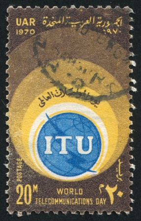 EGYPT - CIRCA 1970: stamp printed by Egypt, shows World telecommunication day emblem, circa 1970のeditorial素材