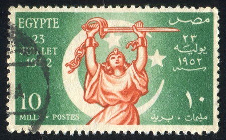 EGYPT - CIRCA 1952: stamp printed by Egypt, shows Crescent, woman sculpture, circa 1952のeditorial素材
