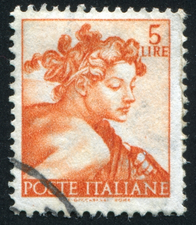 ITALY - CIRCA 1961: stamp printed by Italy, shows Designs from Sistine Chapel by Michelangelo, Head of the slave, circa 1961のeditorial素材