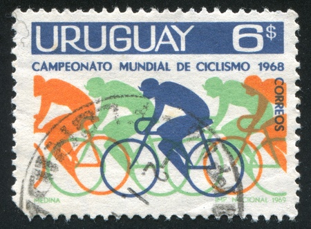 URUGUAY - CIRCA 1969: stamp printed by Uruguay, shows Bicyclists, circa 1969のeditorial素材