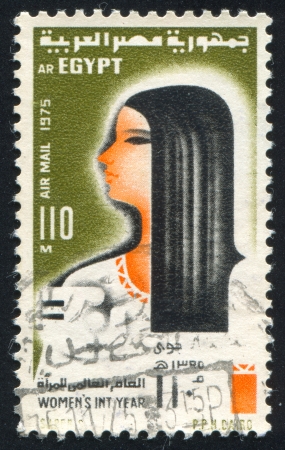 EGYPT - CIRCA 1975: stamp printed by Egypt, shows Woman, circa 1975のeditorial素材