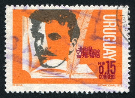 URUGUAY - CIRCA 1975: stamp printed by Uruguay, shows Julio Herrera y Reissig, circa 1975のeditorial素材