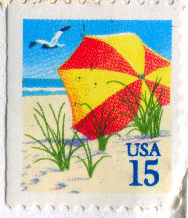 UNITED STATES - CIRCA 1990: stamp printed by United States, shows Beach Umbrella, circa 1990のeditorial素材