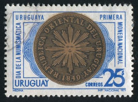 URUGUAY - CIRCA 1971: stamp printed by Uruguay, shows First Coin of Uruguay, Reverse, circa 1971のeditorial素材