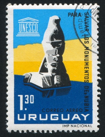 URUGUAY - CIRCA 1964: stamp printed by Uruguay, shows Submerged Statue of Ramses the Second, circa 1964のeditorial素材