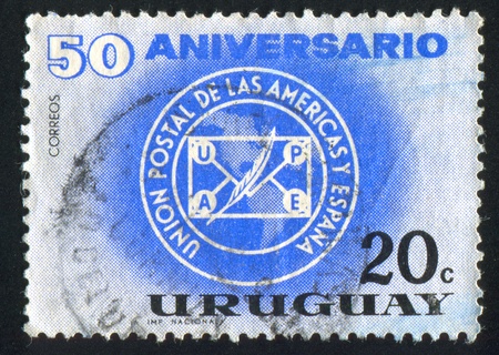 URUGUAY - CIRCA 1963: stamp printed by Uruguay, shows UPAE Emblem, circa 1963のeditorial素材