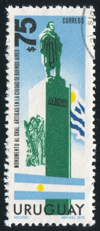 URUGUAY - CIRCA 1974: stamp printed by Uruguay, shows Artigas Statue in Buenos Aeros, Flags of Argentina and Uruguay, circa 1974のeditorial素材