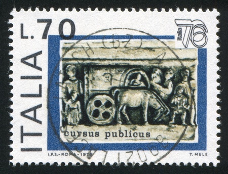 ITALY - CIRCA 1976: stamp printed by Italy, shows Cart from Trajan column, circa 1976のeditorial素材