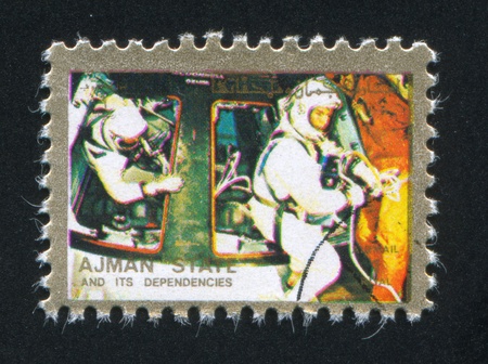 AJMAN - CIRCA 1972: stamp printed by Ajman, shows astronaut, circa 1972のeditorial素材