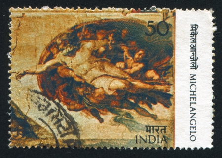 INDIA - CIRCA 1975: stamp printed by India, shows fresco Creation of Adam by Michelangelo, circa 1975のeditorial素材