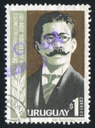 URUGUAY - CIRCA 1967: stamp printed by Uruguay, shows Jose Enrique Rodo, circa 1967のeditorial素材