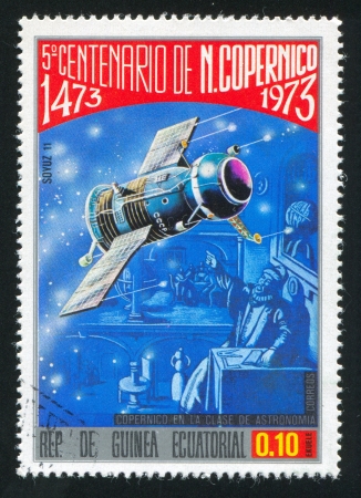 EQUATORIAL GUINEA - CIRCA 1973:  stamp printed by Equatorial Guinea, shows satellite, circa 1973.のeditorial素材