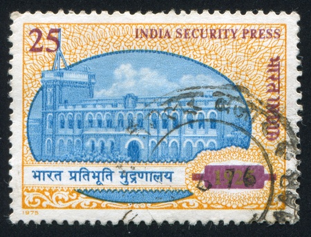 INDIA - CIRCA 1975: stamp printed by India, shows press building, circa 1975のeditorial素材