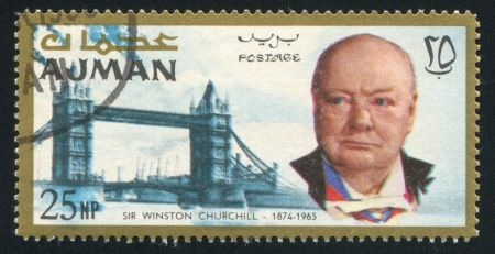 AJMAN - CIRCA 1976: stamp printed by Ajman, shows Winston Churchill and Tower Bridge, circa 1976のeditorial素材