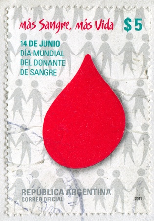 ARGENTINA - CIRCA 2011: stamp printed by Argentina, shows an Emblem of World day of Blood Donors, circa 2011のeditorial素材