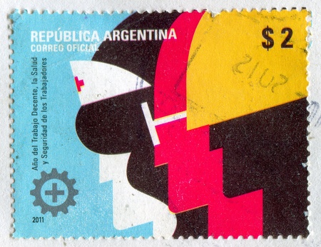 ARGENTINA - CIRCA 2011: stamp printed by Argentina, shows Emblem of Year of Labour, circa 2011のeditorial素材