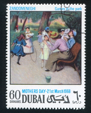 DUBAI - CIRCA 1968: stamp printed by Dubai, shows Games in the park by Zandomeneghi, circa 1968のeditorial素材