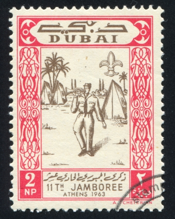 DUBAI - CIRCA 1963: stamp printed by Dubai, shows Jamboree, circa 1963のeditorial素材