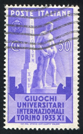 ITALY - CIRCA 1933: stamp printed by Italy, shows Statue of Athlete, circa 1933のeditorial素材