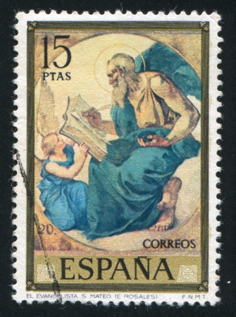 SPAIN - CIRCA 1974: stamp printed by Spain, shows Saint Matthew (Eduardo Rosales), circa 1974のeditorial素材