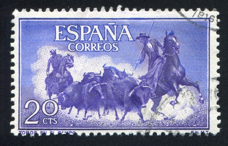 SPAIN - CIRCA 1960: stamp printed by Spain, shows Rounding up bulls, circa 1960のeditorial素材