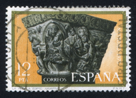 SPAIN - CIRCA 1975: stamp printed by Spain, shows Flight into Egypt, Carved Capital, Navarra, Cathedral, circa 1975のeditorial素材