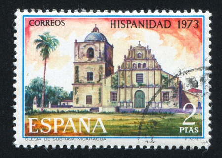 SPAIN - CIRCA 1973: stamp printed by Spain, shows Subtiava Church, Nicaragua, circa 1973のeditorial素材