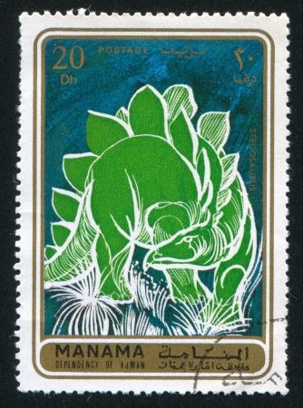 MANAMA - CIRCA 1971: stamp printed by Manama, shows a Dinosaur, circa 1971のeditorial素材
