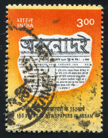INDIA - CIRCA 1999: stamp printed by India, shows fragment of newspaper, circa 1999のeditorial素材