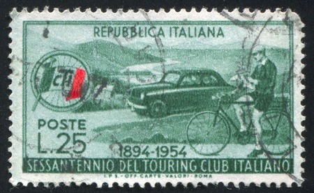 ITALY - CIRCA 1954: stamp printed by Italy, shows Automobile and Cyclist, Italian Touring Club, circa 1954のeditorial素材