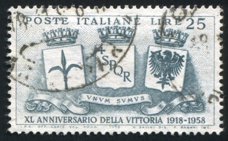 ITALY - CIRCA 1958: stamp printed by Italy, shows Coats of Arms of Trieste, Rome and Trento, circa 1958のeditorial素材