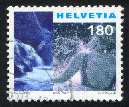 SWITZERLAND - CIRCA 2000: stamp printed by Switzerland, shows Vals hot springs, bather, circa 2000のeditorial素材