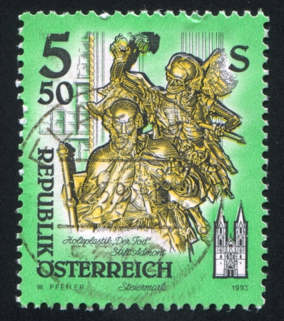 AUSTRIA - CIRCA 1993: stamp printed by Austria, shows Death, wooden statue by Josef Stammel, circa 1993のeditorial素材