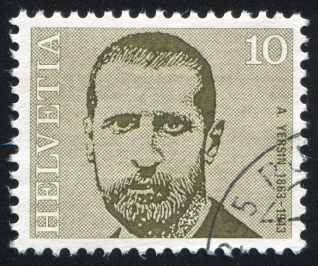 SWITZERLAND - CIRCA 1971: stamp printed by Switzerland, shows Alexandre Yersin, circa 1971のeditorial素材