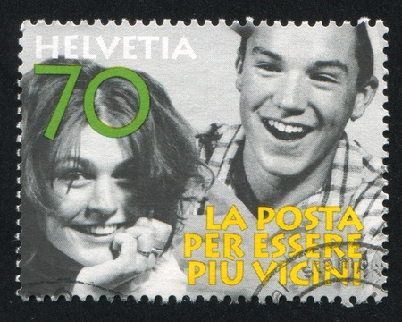 SWITZERLAND - CIRCA 1997: stamp printed by Switzerland, shows Laughing people, circa 1997のeditorial素材