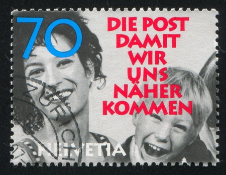SWITZERLAND - CIRCA 1997: stamp printed by Switzerland, shows Laughing people, circa 1997のeditorial素材