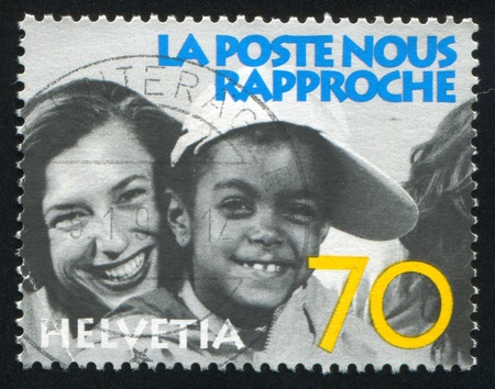 SWITZERLAND - CIRCA 1997: stamp printed by Switzerland, shows Laughing people, circa 1997のeditorial素材
