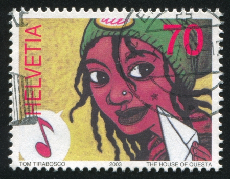 SWITZERLAND - CIRCA 2003: stamp printed by Switzerland, shows Women and musical note, circa 2003のeditorial素材