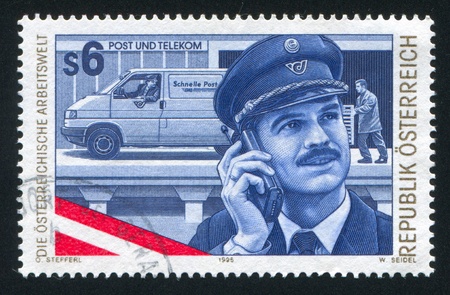 AUSTRIA - CIRCA 1995: stamp printed by Austria, shows postman, cellphone, car, circa 1995のeditorial素材