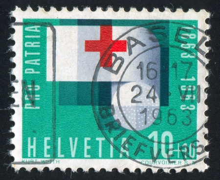 SWITZERLAND - CIRCA 1963: stamp printed by Switzerland, shows Bandage Roll, circa 1963のeditorial素材