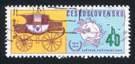 CZECHOSLOVAKIA - CIRCA 1974: stamp printed by Czechoslovakia, shows Universal Postal Union Emblem and Mail coach, circa 1974のeditorial素材